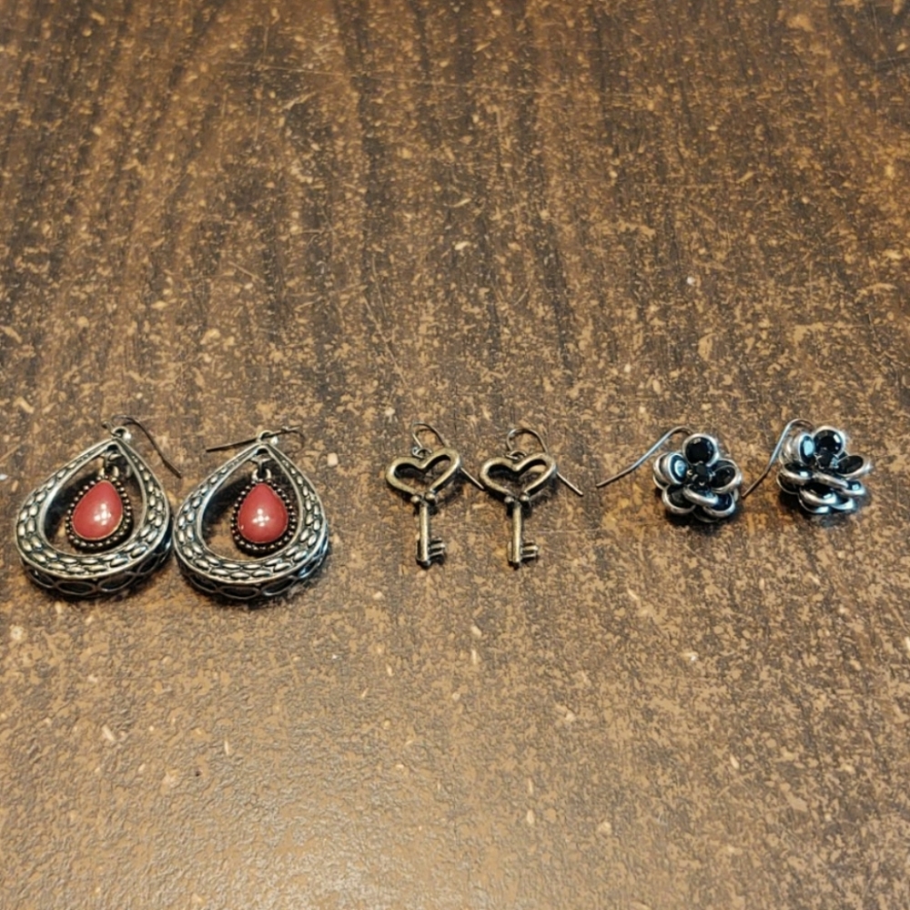 3 pairs of earrings, gold, silver, & red